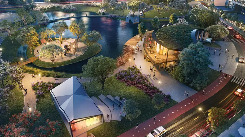 Imagem ilustrativa: vista aérea do Parque Una à noite, com lago, playground em ilha, ciclovia e rua